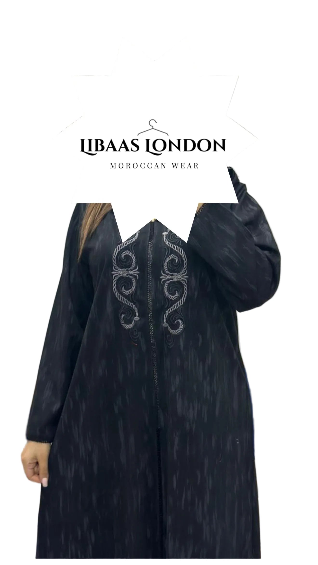 Detail of black Moroccan djellaba fabric and hood design for women
