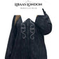 Detail of black Moroccan djellaba fabric and hood design for women